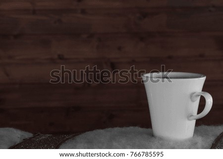 simple white ceramic coffee cup on a wooden background