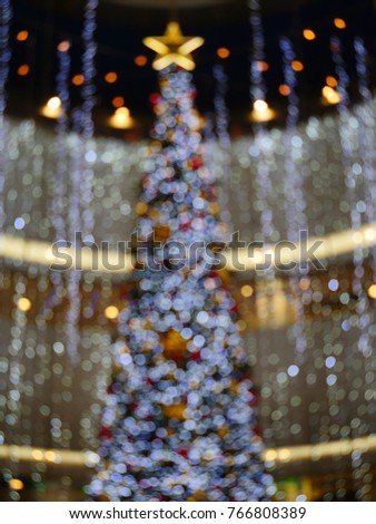 Brurred christmas lights, festival background in a shopping mall