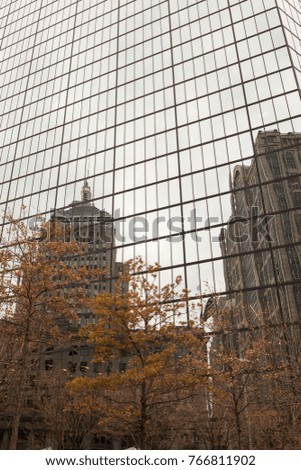 Boston city skyline reflected in glass of building