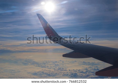 Morning sunrise with Wing of an airplane.  picture for add text message or frame website. Traveling concept