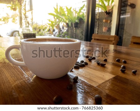 Hot coffee on wooden table