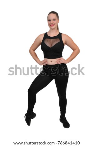 Beautiful woman doing her Yoga stance exercises