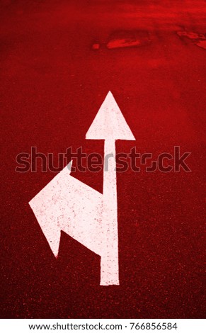 Directional arrow on asphalt, information detail signal on the road, textured background