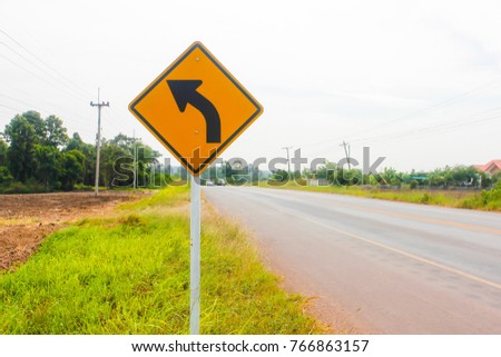 Road sign indicating left turn