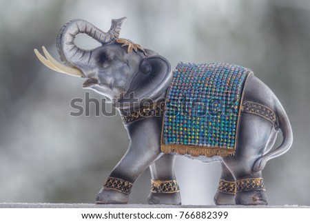 Miniature elephant. Strong Bokeh. Colorful picture