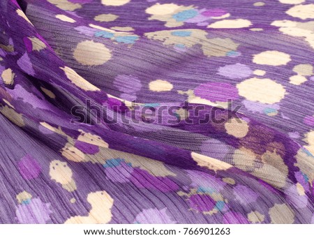 Fabric silk texture, color, abstraction. a fine, strong, soft, lustrous fiber produced by silkworms in making cocoons and collected to make thread and fabric.