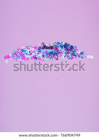 Violet and blue stars are mirror shiny, glitter wallpapers, sparkles scattered on a delicate lilac paper background, ideal for Christmas, New Year or any other holidays