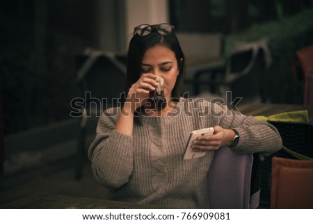 
portrait girl, happy man with mobile phone in hand, girl drinking tea at the head