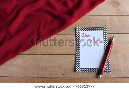 Letter to Santa on a wooden background 