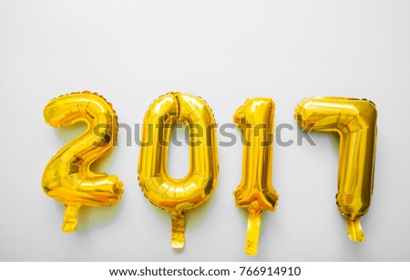 Golden toy balloons isolated on white background. Happy New Year 2017. photo image icon