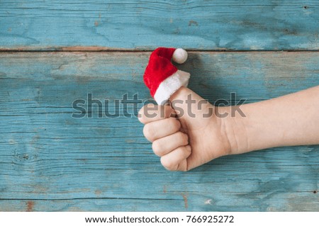 Happy finger family celebrating christmas on wood background