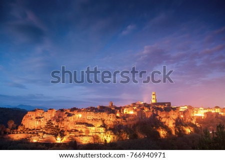 The ancient Etruscan town of Pitigliano at night in light of lanterns, landscape, Tuscany, Itali