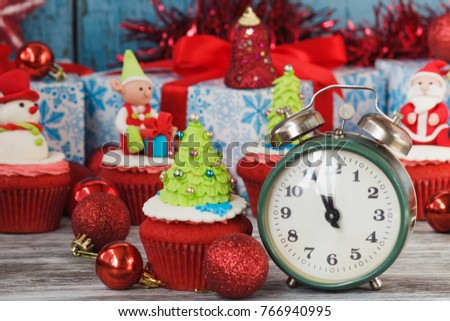 Christmas cupcakes with colored decorations Christmas Tree made from confectionery mastic, soft focus background