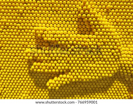 Hands on yellow honeycomb.