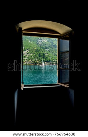 Open window with sea and mountain views
