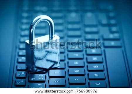 Computer security concept. Padlock on computer keyboard  Royalty-Free Stock Photo #766980976