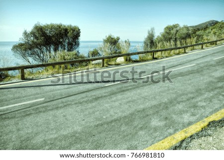 Empty two lane asphalt road highway vanishing in perspective
