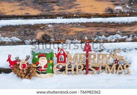 Christmas Cup and Wooden Merry Christmas Sign  on a  Rustic Wooden Background. Festive Card
