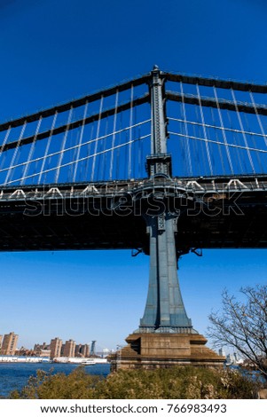 Low angle view of a detail of the Brooklyn Bridge in New-York.