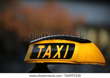 yellow taxi sign