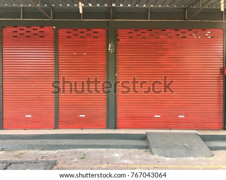 Frame of orange shutter door. Royalty-Free Stock Photo #767043064