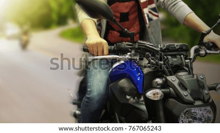 Close up of a high power driving a motorcycle