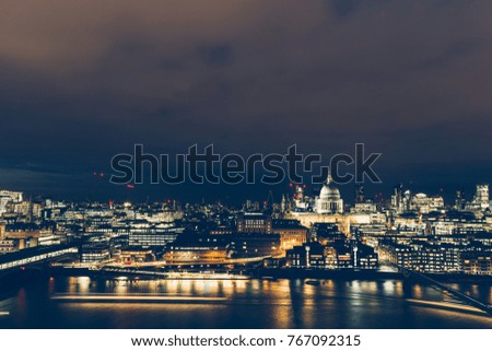 Elevated aerial view of modern London cityscape buildings skyline at night