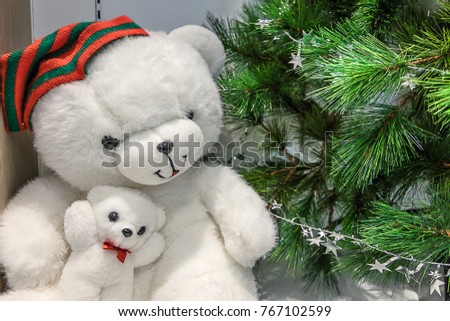 Cute little teddy bear with Chrismas tree brings happiness sent on Christmas and every day on a wood background or happy holiday concept,vintage style.