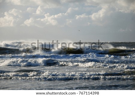 High waves on stormy North Sea beach at Texel Netherlands