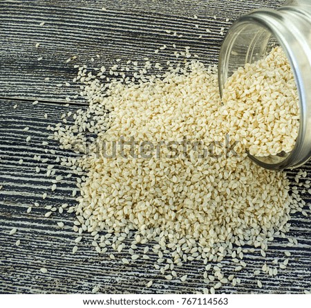 natural sesame seeds, sesame seeds, sesame seeds in plates, raw sesame seeds for cake and bread,

