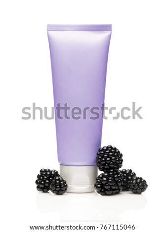 Violet cosmetic tube with blackberry on white background