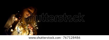 woman with christmas tree lights