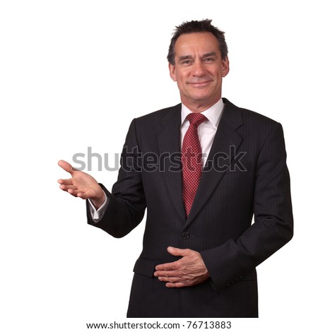 Attractive Smiling Middle Age Business Man in Suit Gesturing Welcome Royalty-Free Stock Photo #76713883