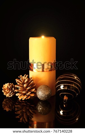christmas decorations with pine cones and candel light no people stock photo
