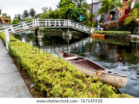 Venice Canals, white bridge and kayak boat - Venice Beach, Los Angeles, California, USA