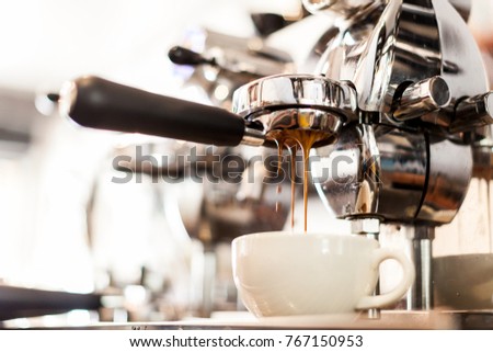 coffee extraction from professional coffee machine with bottomless filter Royalty-Free Stock Photo #767150953