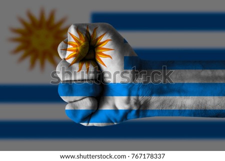 Fist painted in colors of Uruguay flag, fist flag, country of Uruguay