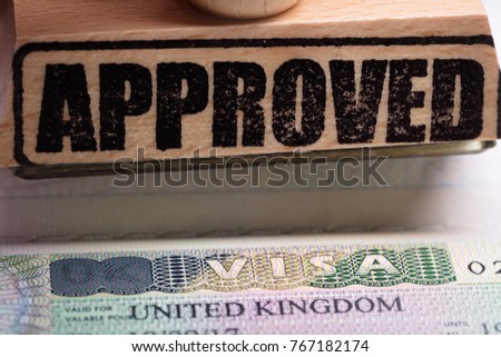 Close-up Photo Of Approved Stamp And UK Visa Royalty-Free Stock Photo #767182174