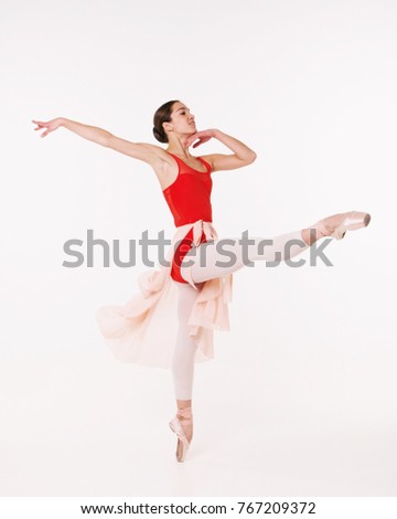Beautiful ballerina posing in a white studio. Ballerina on a white background. Ballerina in red tights.