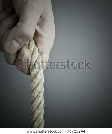 pulling the rope. Grey background