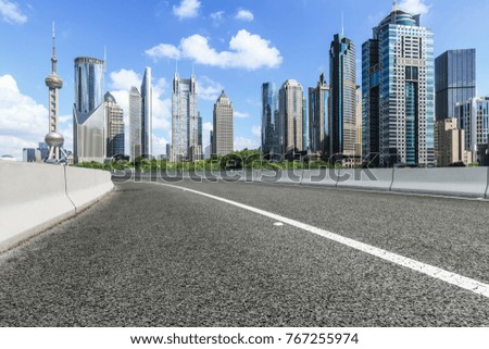 Asphalt road and modern city commercial buildings in Shanghai,China
