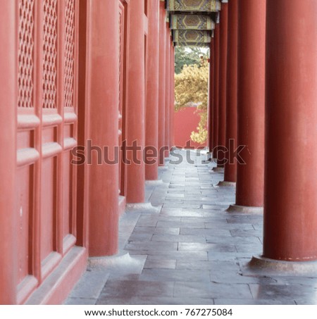 Ancient Chinese buildings with red doors and posts