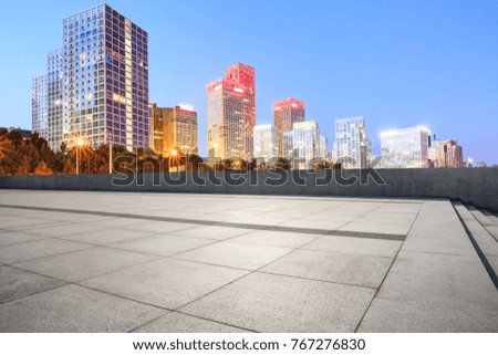 Empty city square road and modern business district office buildings in Beijing at night,China