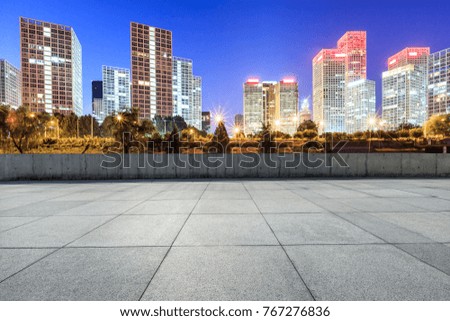 Empty city square road and modern business district office buildings in Beijing at night,China