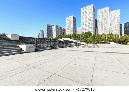 Empty city square road and modern business district office buildings in Beijing,China