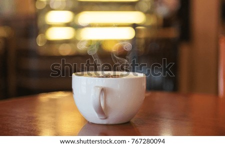 A cup of hot coffee in the coffee shop
