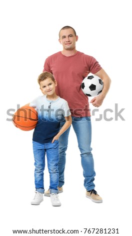 Dad and his son with basketball and soccer balls on white background