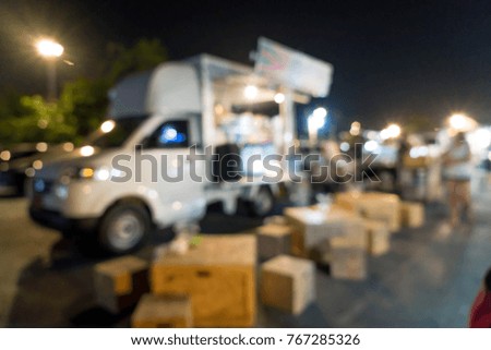 abstract blur food truck at night street market in Thailand for background