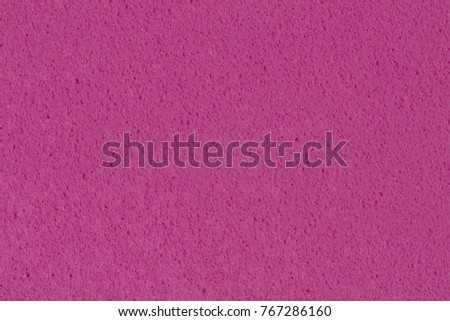 Porous saturated violet foam (EVA) texture. High resolution photo.