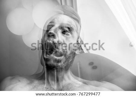 Man with suffocation and anguish of death, suffering of schizophrenia and mental disorder, mad man screaming, horrible nightmare Royalty-Free Stock Photo #767299477
